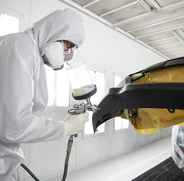 Collision Center Technician Painting a Vehicle | Swickard Toyota in Edmonds WA